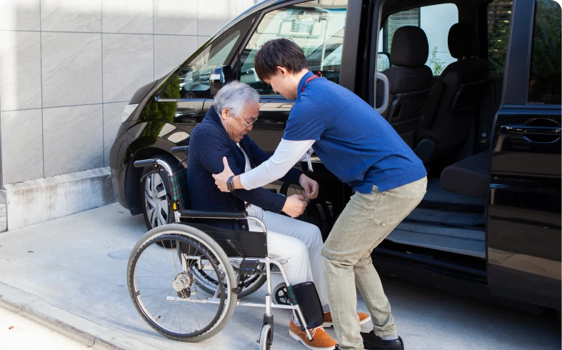 Helping elderly person into vehicle